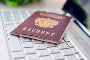 passport-of-russian-federation-on-gray-laptop-keyboard-identification-of-the-user-on-the-internet-prohibition-of-access-to-the-internet-without-passport-data-issuing-passport-via-the-internet