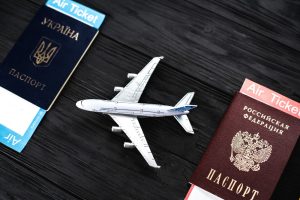 ukrainian-and-russian-passports-aircraft-model-passenger-transportation-concept-between-ukraine-and-russia-translation-ukraine-passport-russian-federation